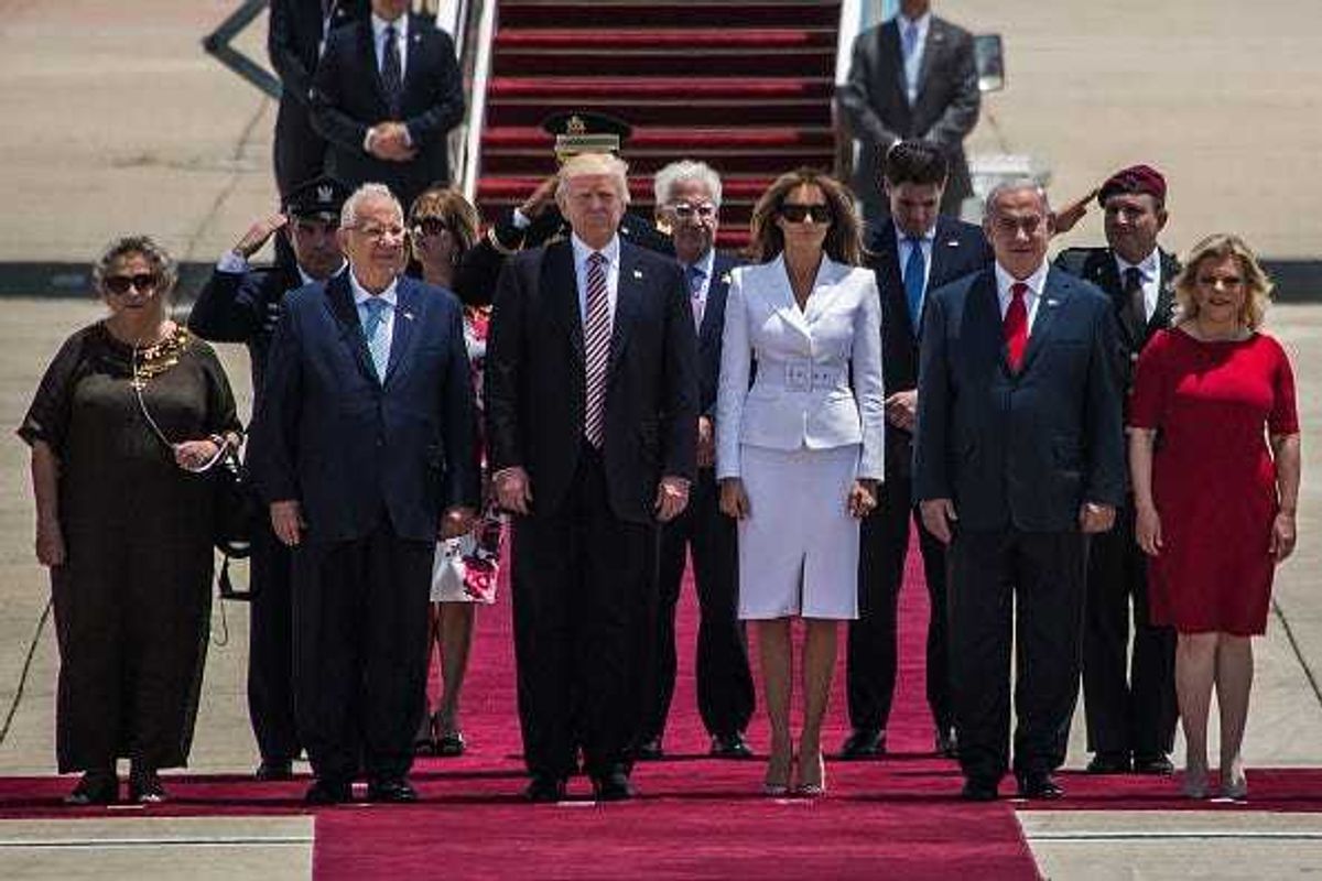 US President Donald Trump and his wife Melania Trump(C) standing surrunded by Israeli Prime Minister Benjamin Netanyahu and his wife Sara Netanyahu (R) as Israeli President Reuven Rivlin and his wife Nehama Rivlin (L) during an official welcoming ceremony on his arrival at Ben Gurion International Airport on May 22, 2017 near Tel Aviv, Israel.