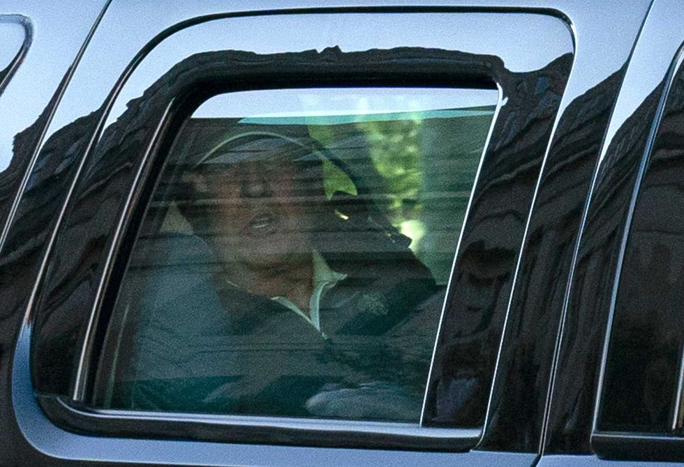 US President Donald Trump watches from the motorcade as he returns to the White House in Washington, DC, after playing golf on November 7, 2020.