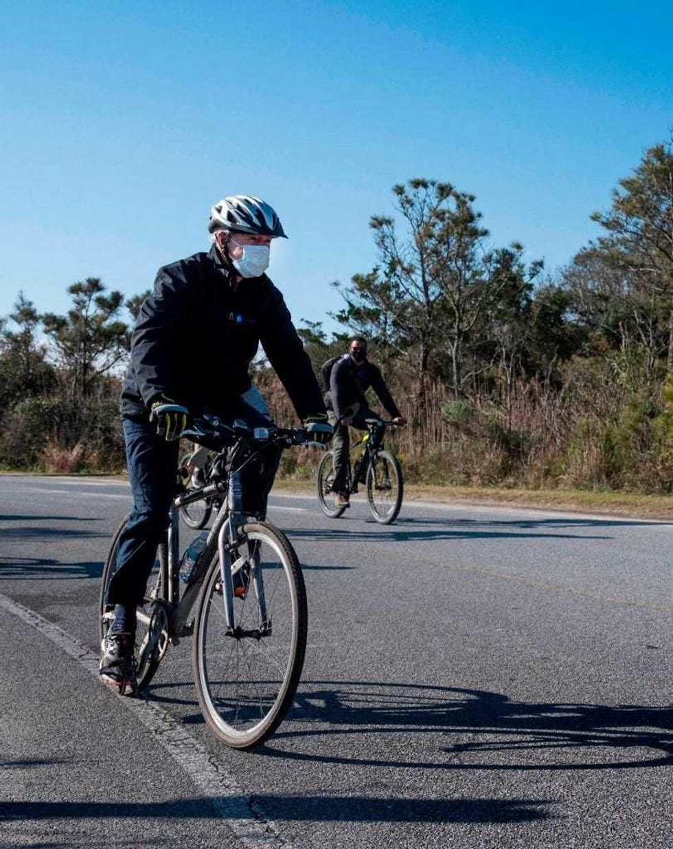 US President-elect Joe Biden rides his bike at Cape Henlopen State Park near Rehoboth Beach, Delaware, on November 14, 2020.