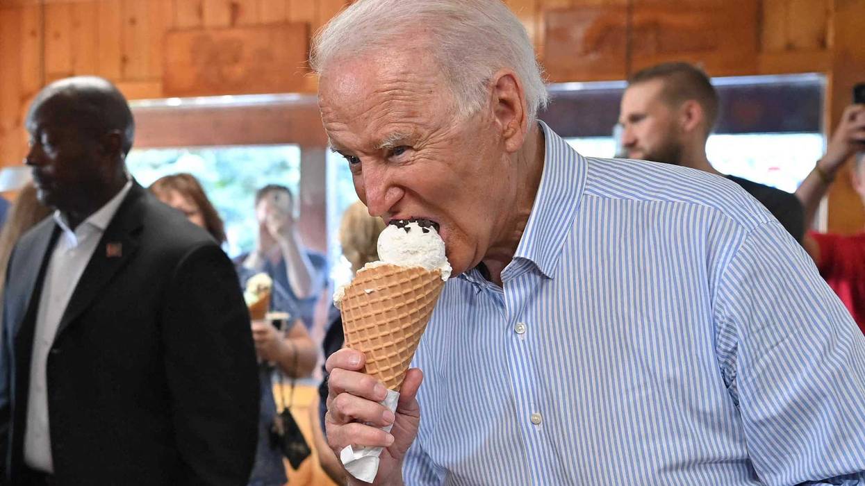 US President Joe Biden eats ice cream at Moomers Homemade Ice Cream in Traverse City, Michigan on July 3, 2021.
