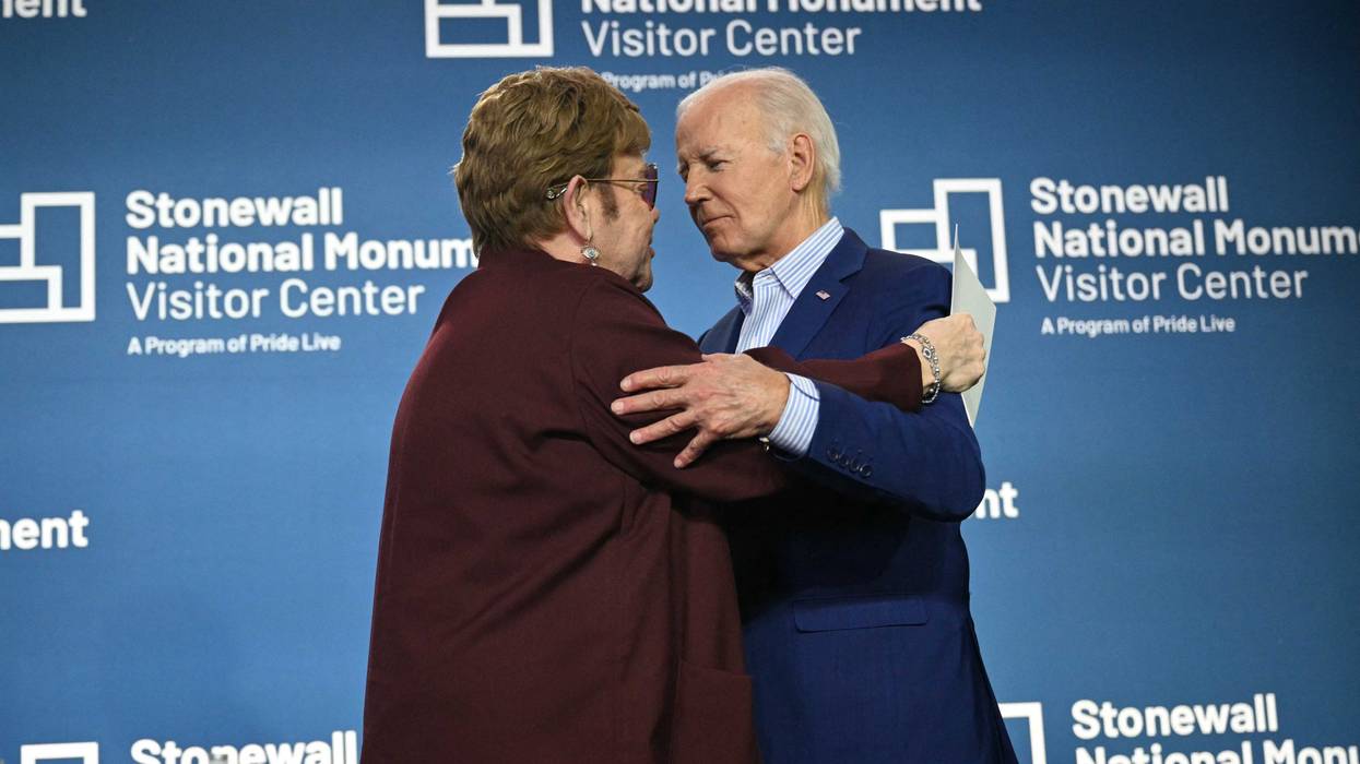 US President Joe Biden greets British musician Elton John on stage at the Stonewall National Monument Visitor Center grand opening ceremony in New York on June 28, 2024.