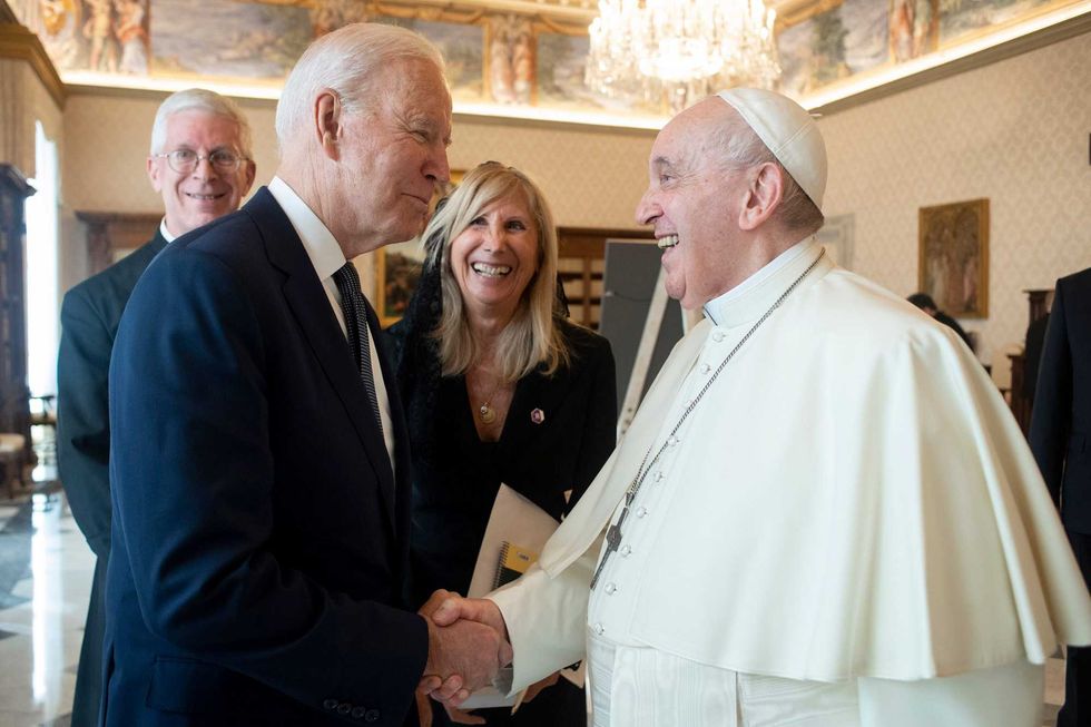 US President Joe Biden, left, shakes hands with Pope Francis as they meet at the Vatican, Friday, Oct. 29, 2021