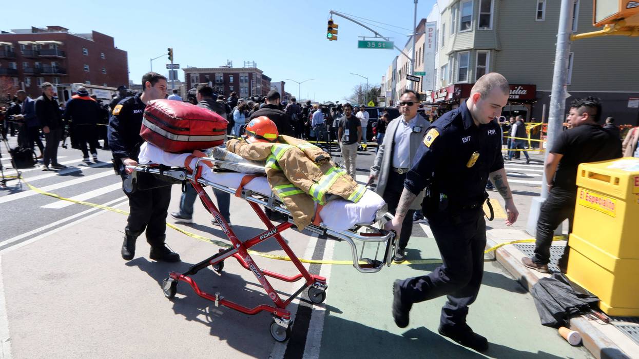 USA; EMT's from the New York City Fire Department work near the scene of a subway shooting in Brooklyn, New York on April 12, 2022 where at least ten people were shot during the morning rush hour.