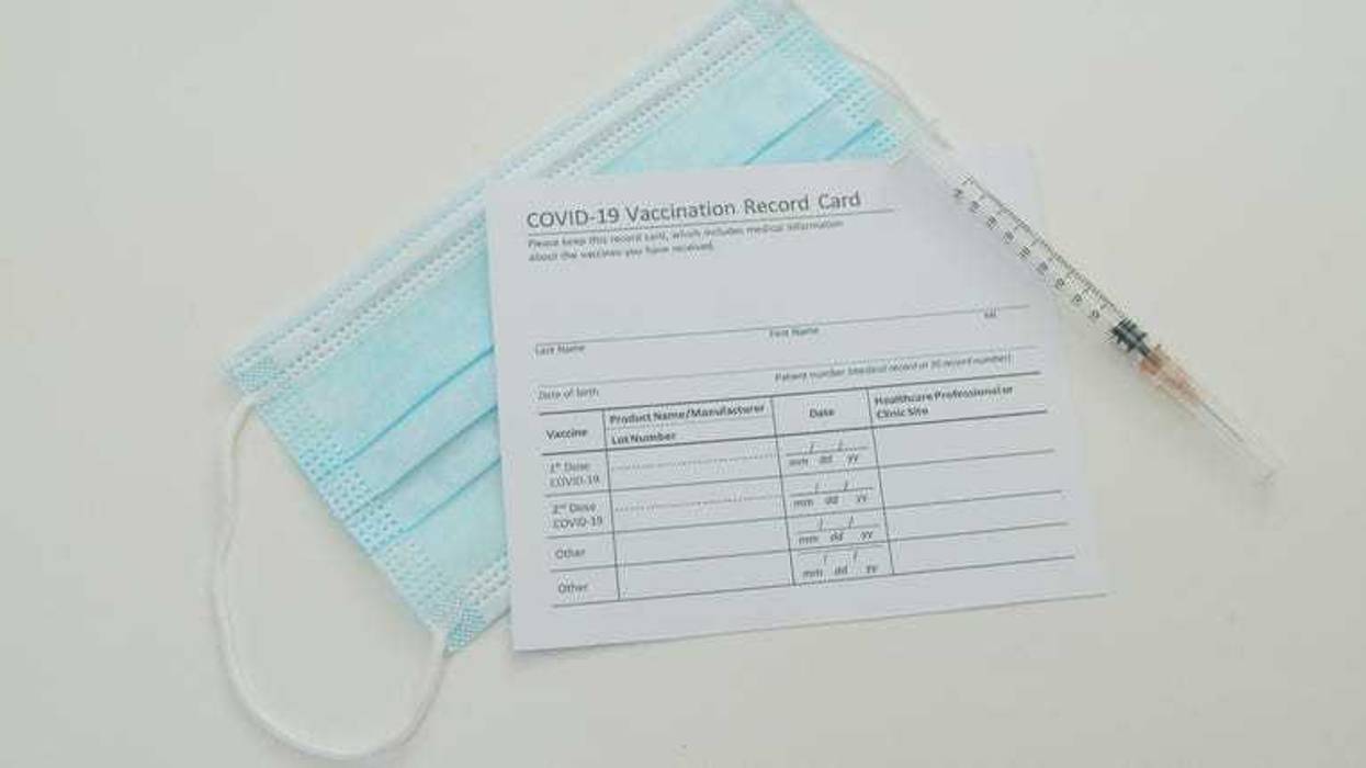Vaccine, mask, and vaccine record card.