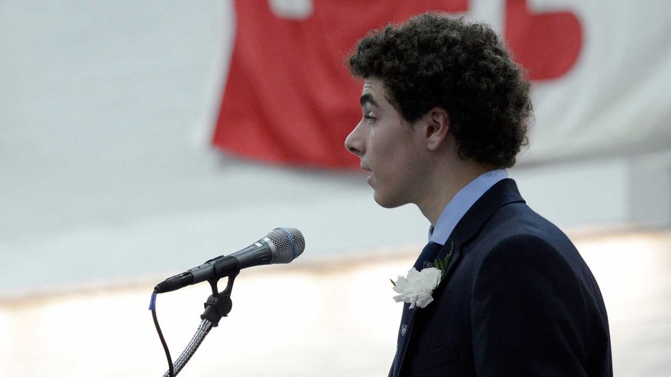 Valedictorian Luigi Mangione gives a farewell speech to the Class of 2016 during commencement at Gilman School in Baltimore