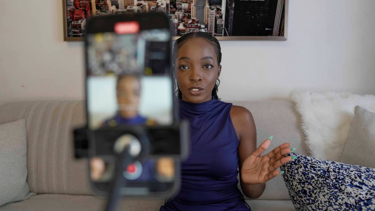 Valerie Akoko, a digital content creator, records a video for TikTok at her house in Tatu city, a startup city that tries to tackle Africa's problem of urbanizing, in Nairobi, Kenya, Friday, Oct. 25, 2024.