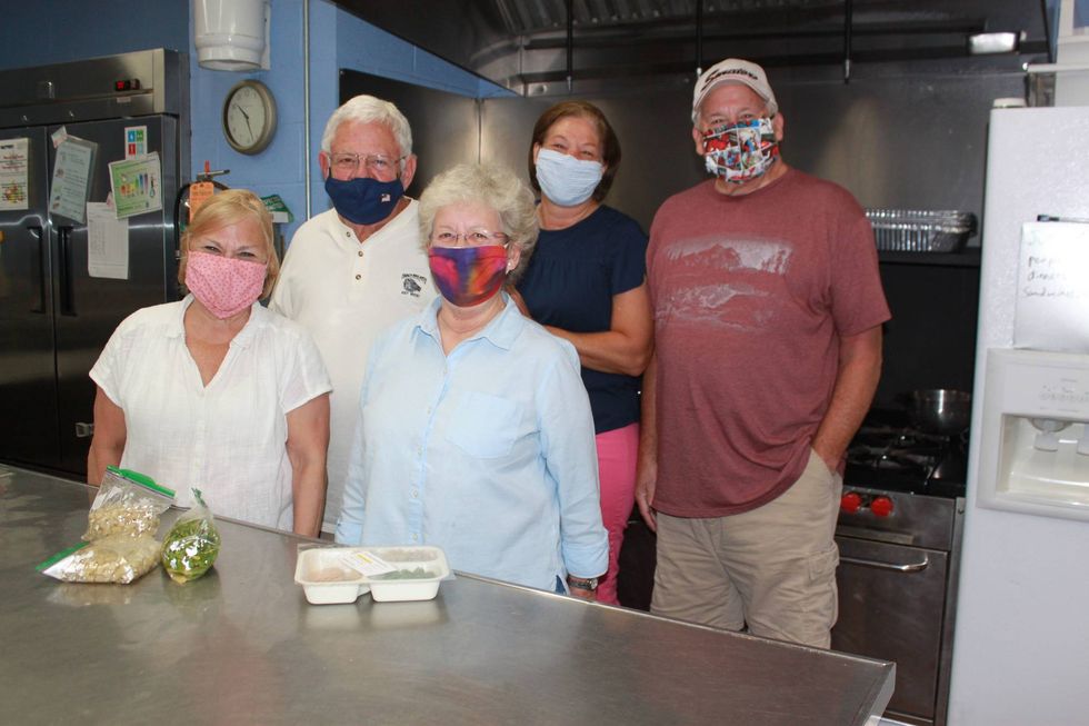 Valerie Frankel, Dave Toler, Betty Anderson, Peggy Cotugno and Mark Frankel in the ktichen at North Country Meals on Wheels.