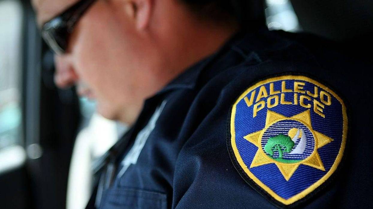 Vallejo Police Department Corporal John Garcia goes over paperwork in his patrol car as he gets ready to patrol the streets May 7, 2008 in Vallejo, California.