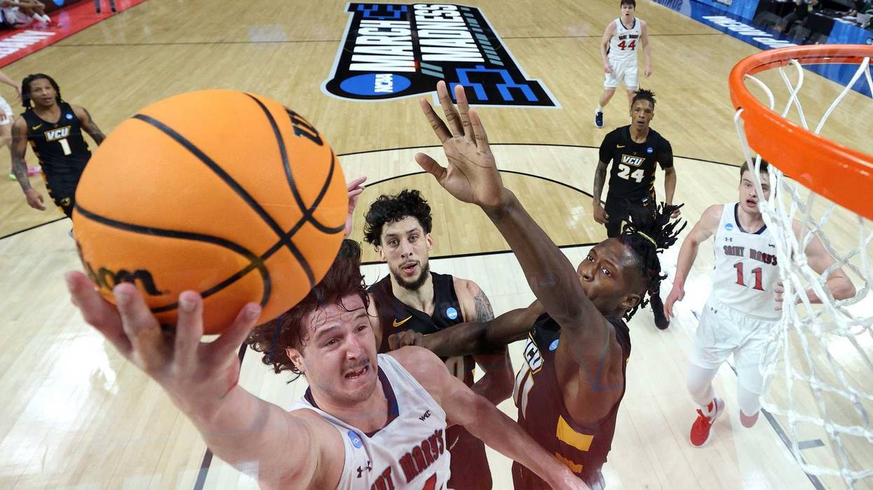 VCU basketball players defend against Kyle Bowen of St. Mary's in their first-round NCAA Tournament matchup in 2023.