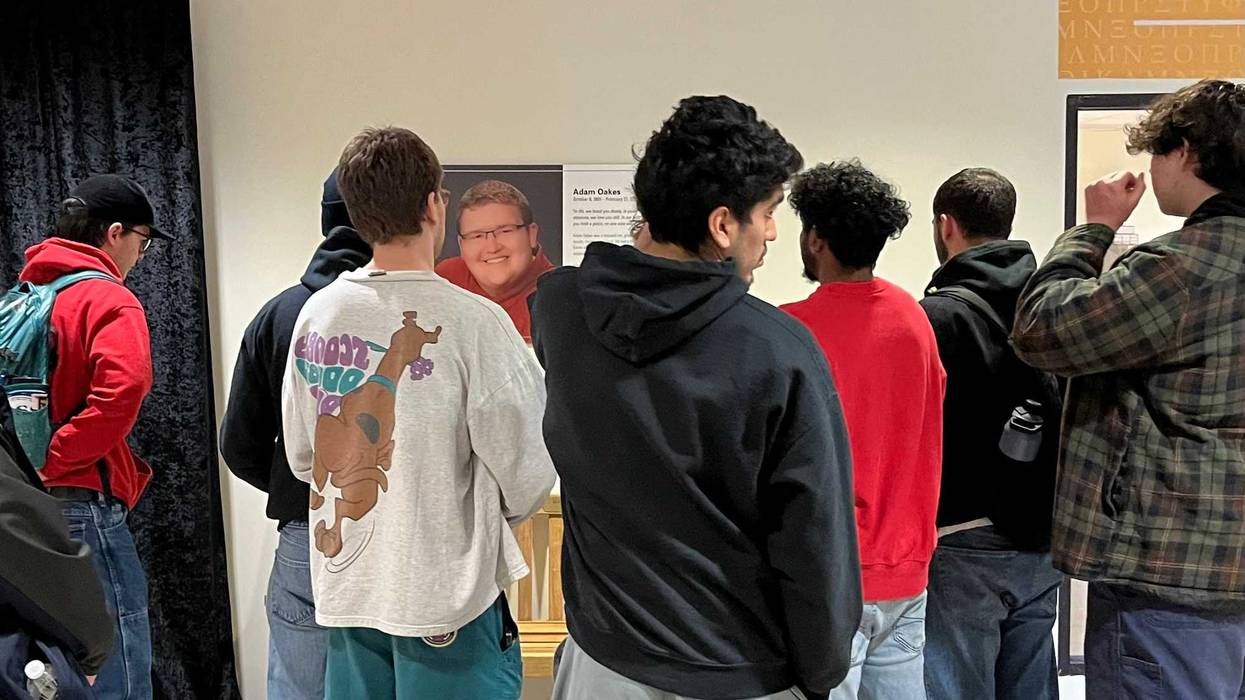 VCU students stand in front of Oakes' commemorative plaque