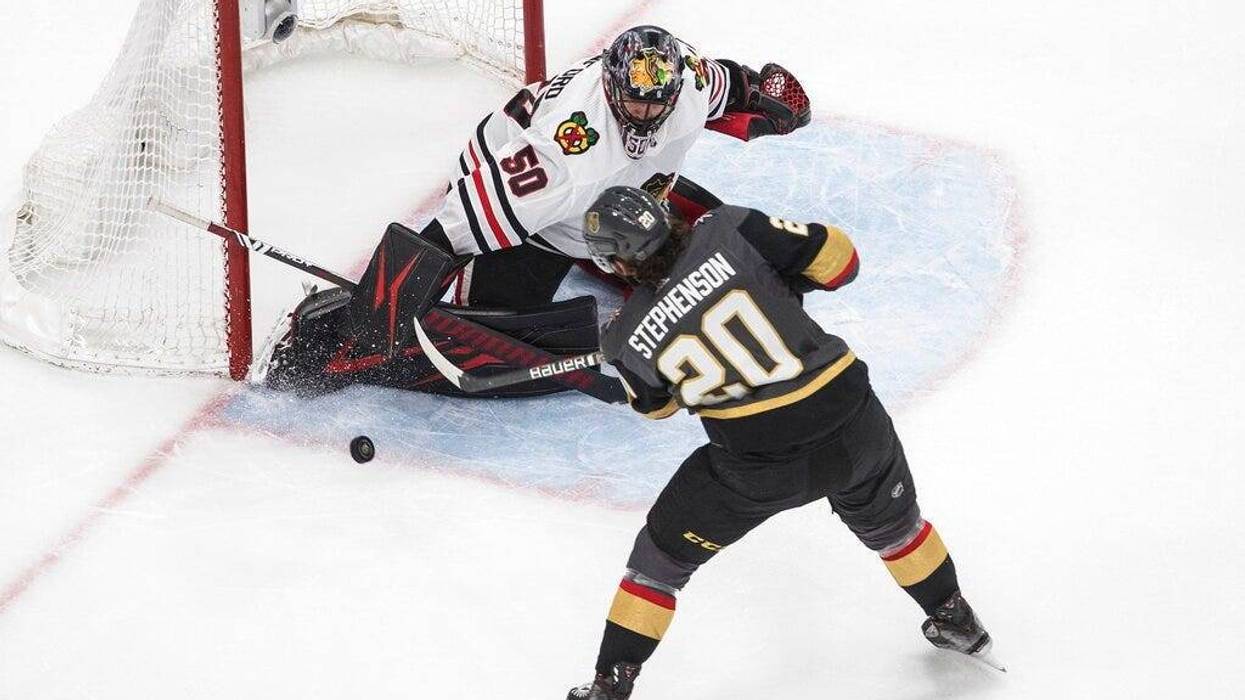 Vegas Golden Knights' Chandler Stephenson (20) is stopped by Chicago Blackhawks goalie Corey Crawford (50) during the second period in Game 5 of an NHL hockey first-round playoff series, Tuesday, Aug. 18, 2020, in Edmonton, Alberta