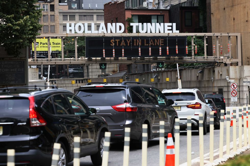 Vehicles wait in traffic to enter the Holland Tunnel in Lower Manhattan