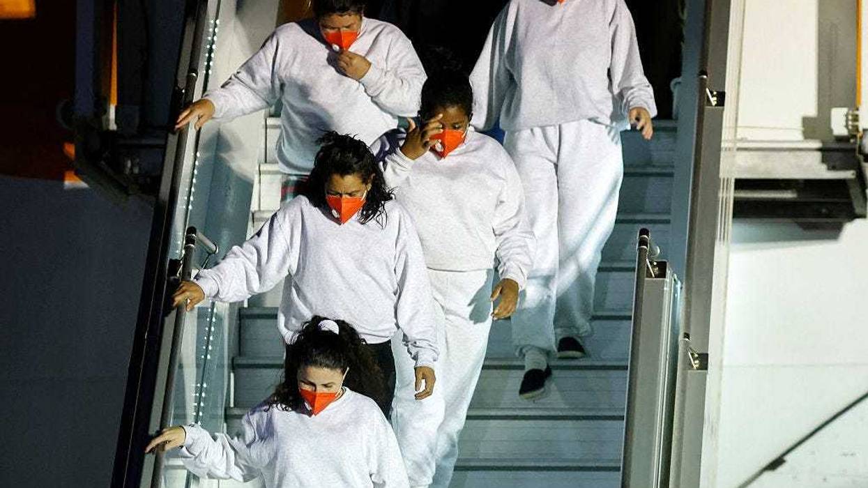 Venezuelan migrants deported from the United States walk down a plane upon arrival at Simon Bolivar International Airport in Maiquetia, Venezuela on March 28, 2025