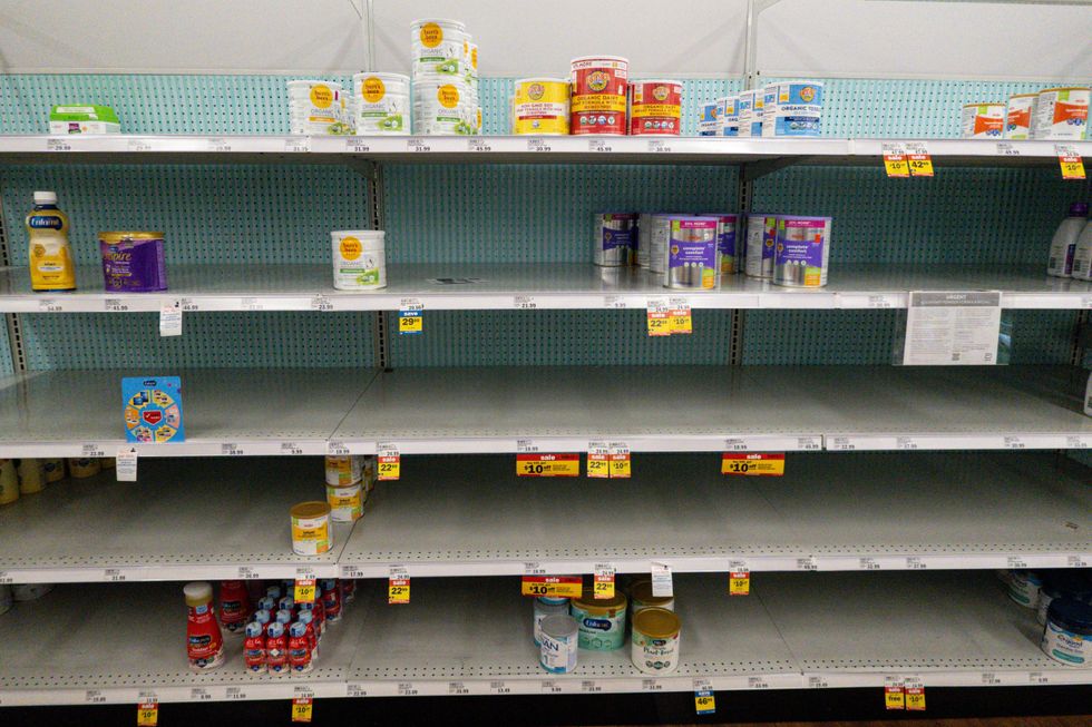 Very few options are left available on the picked-over shelves of a grocery store in Carmel, Ind., Tuesday, May 10, 2022.