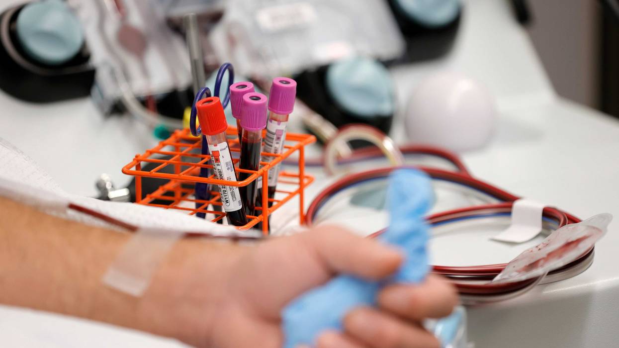 Vials of blood sit on a table at blood donation center