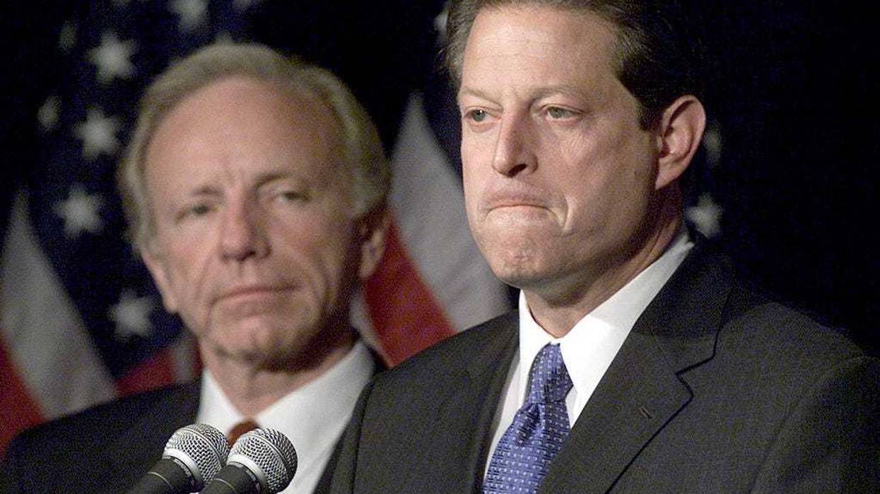 Vice President Al Gore with Sen. Joseph Lieberman by his side makes a statement to reporters, November 8, 2000 in Nashville TN. A sharply and bitterly divided U.S. Supreme Court ruled December 13, 2000 for Republican George W. Bush, halting any more recounts of ballots in Florida and dealing a crushing setback to Democrat Al Gore's hopes of winning the presidency. (Photo by Mark Wilson/Newsmakers)