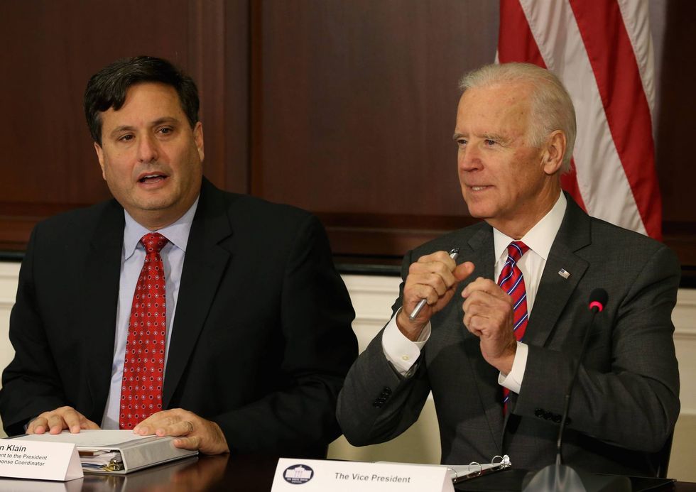 Vice President Joseph Biden (R) and Ebola Response Coordinator Ron Klain (L), participate in a meeting regarding Ebola at the Eisenhower Executive office building November 13, 2014 in Washington, D.C.