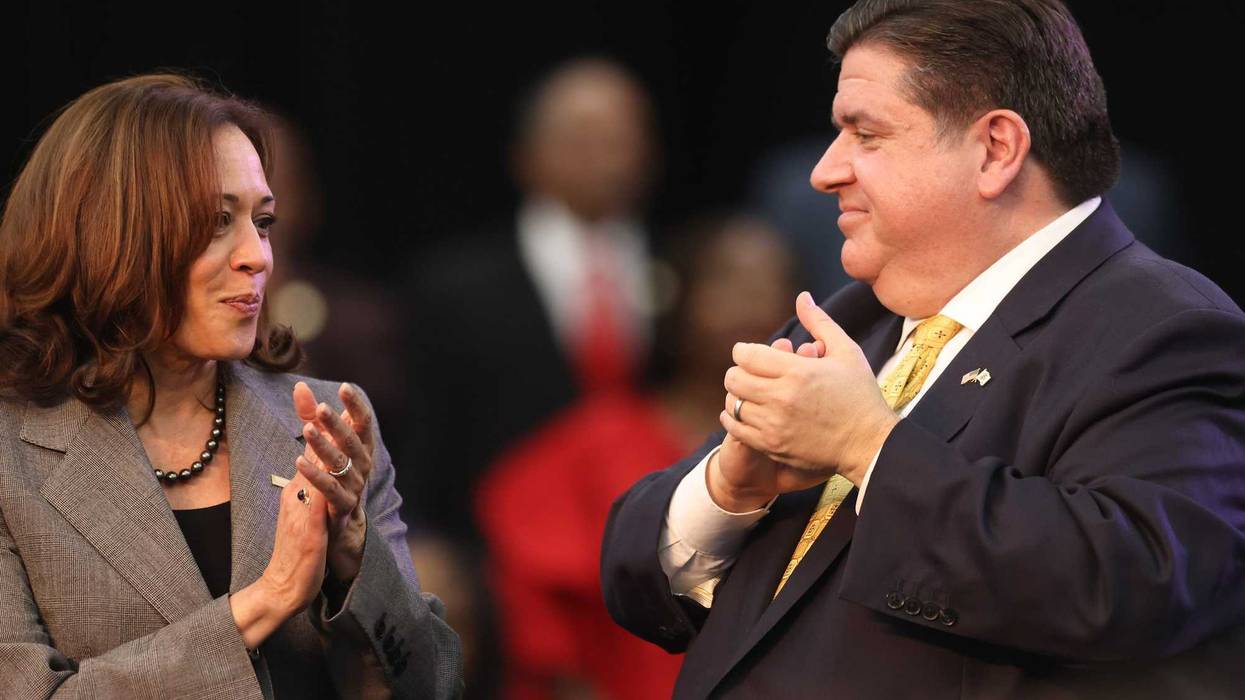 Vice President Kamala Harris and Gov. J.B. Pritzker talk after they gave speeches ahead of midterm elections in Chicago on Nov. 6, 2022.