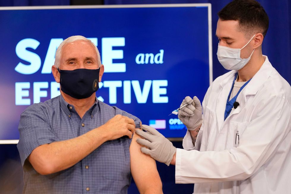Vice President Mike Pence receives a Pfizer-BioNTech COVID-19 vaccine shot at the Eisenhower Executive Office Building on the White House complex, Friday, Dec. 18, 2020, in Washington.