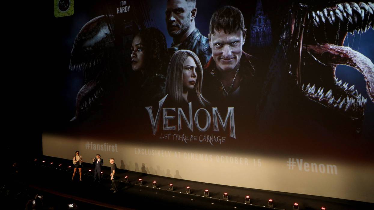 Vick Hope, Andy Serkis and Tom Hardy on stage at the fan screening of "Venom: Let There Be Carnage" at Cineworld Leicester Square on September 14, 2021 in London, England.