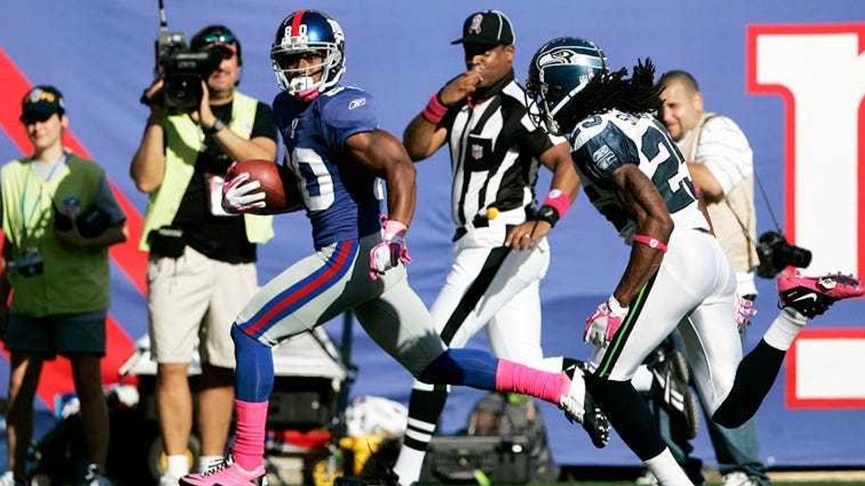 Victor Cruz scores on a 68-yard pass against the Seattle Seahawks on Oct. 9, 2011, at MetLife Stadium.