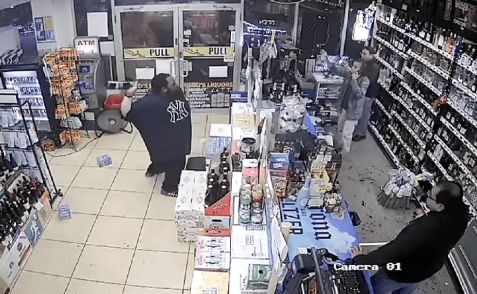 Video shows a man tossing red wine at workers inside Beno