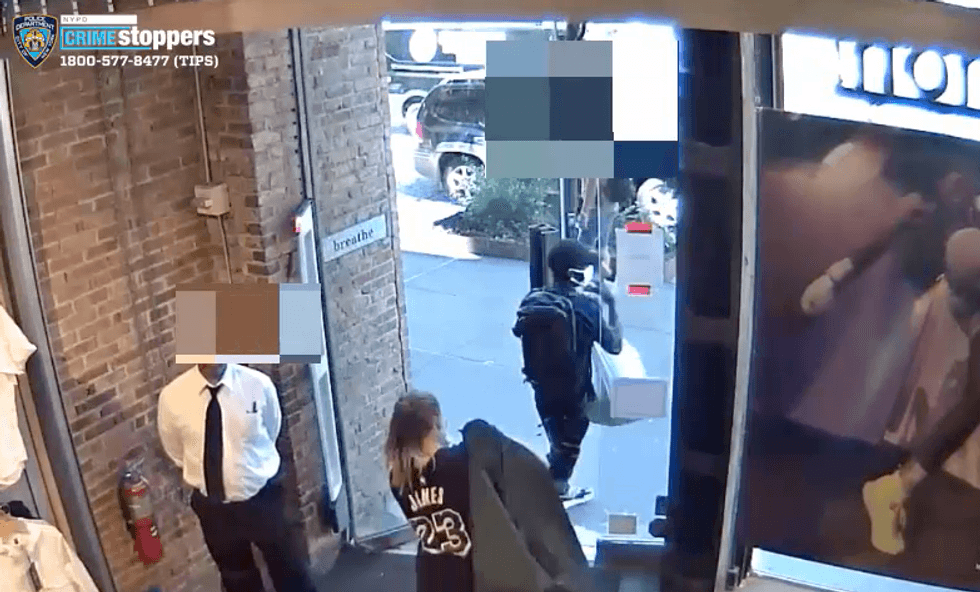 Video shows seven people casually walking out of the Lululemon on W. 14th Street with piles of stolen clothing, police said