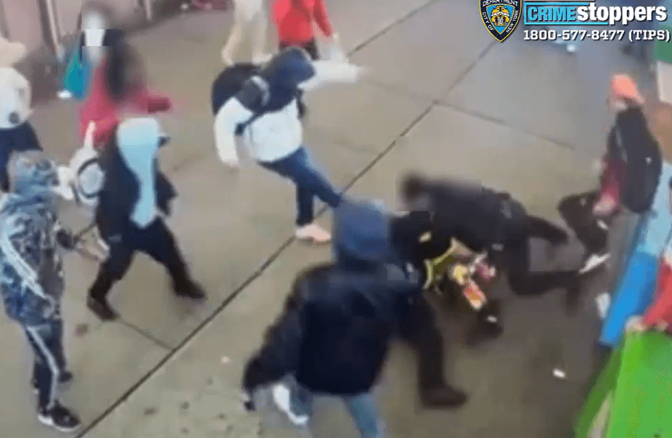 Video shows the group brazenly attacking the cops on a sidewalk