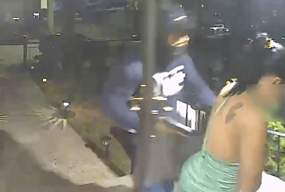 Video shows the men forcing their way into the woman