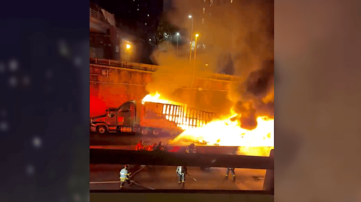 Video shows the semi-trucks and car consumed by fire after the crash