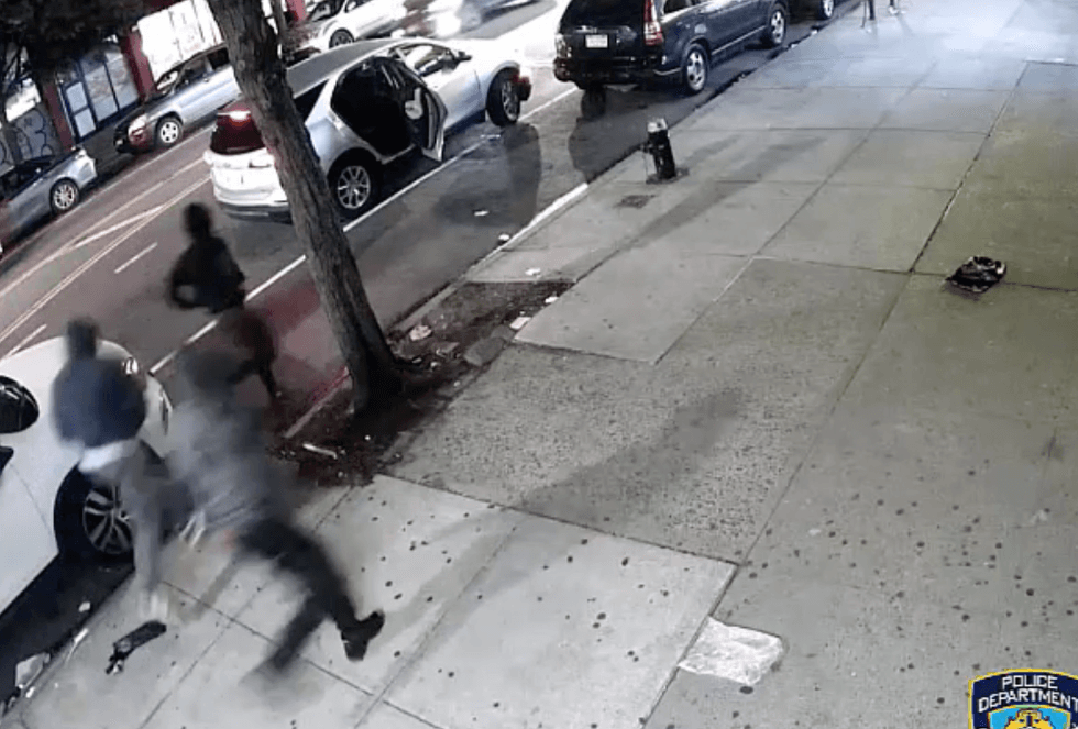 Video shows the suspects fleeing back to a silver SUV after robbing an off-duty NYPD officer and his two cousins in Inwood early last Friday morning.