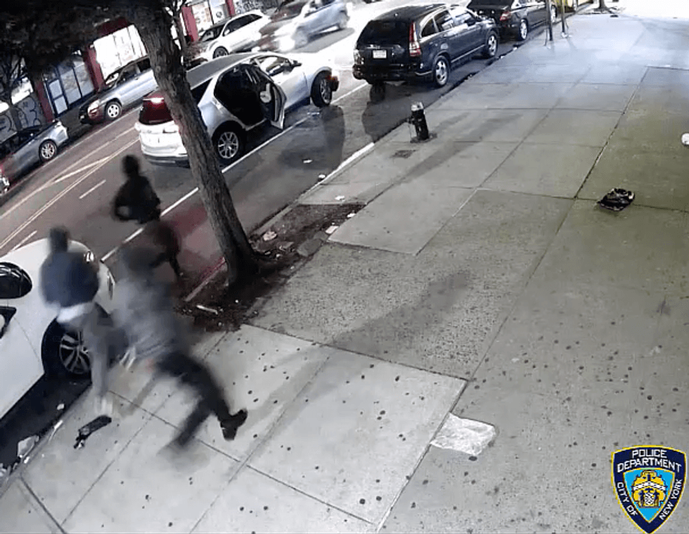 Video shows the suspects fleeing back to a silver SUV after robbing an off-duty NYPD officer and his two cousins in Inwood early last Friday morning