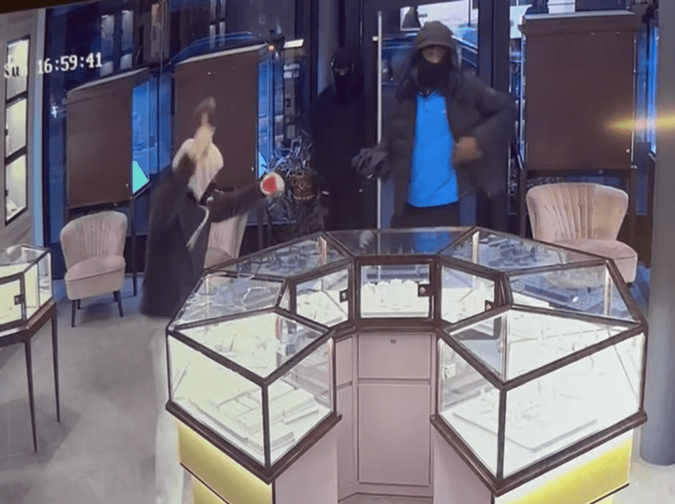 Video shows the trio smashing glass display cases and tossing merchandise into bags on the evening of Jan. 8, 2023