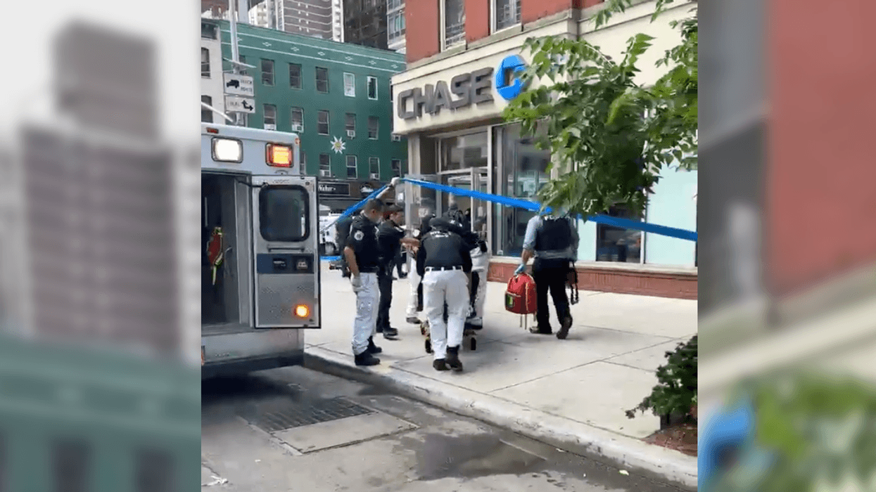 Video shows the victim being rushed out of the Chase Bank at E. 86th Street and Second Avenue on the Upper East Side Friday morning