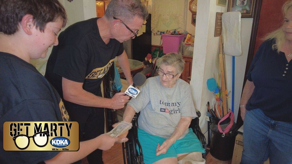 Vincent "Vman" Griffin counts out the cash from another surprise for Lucille