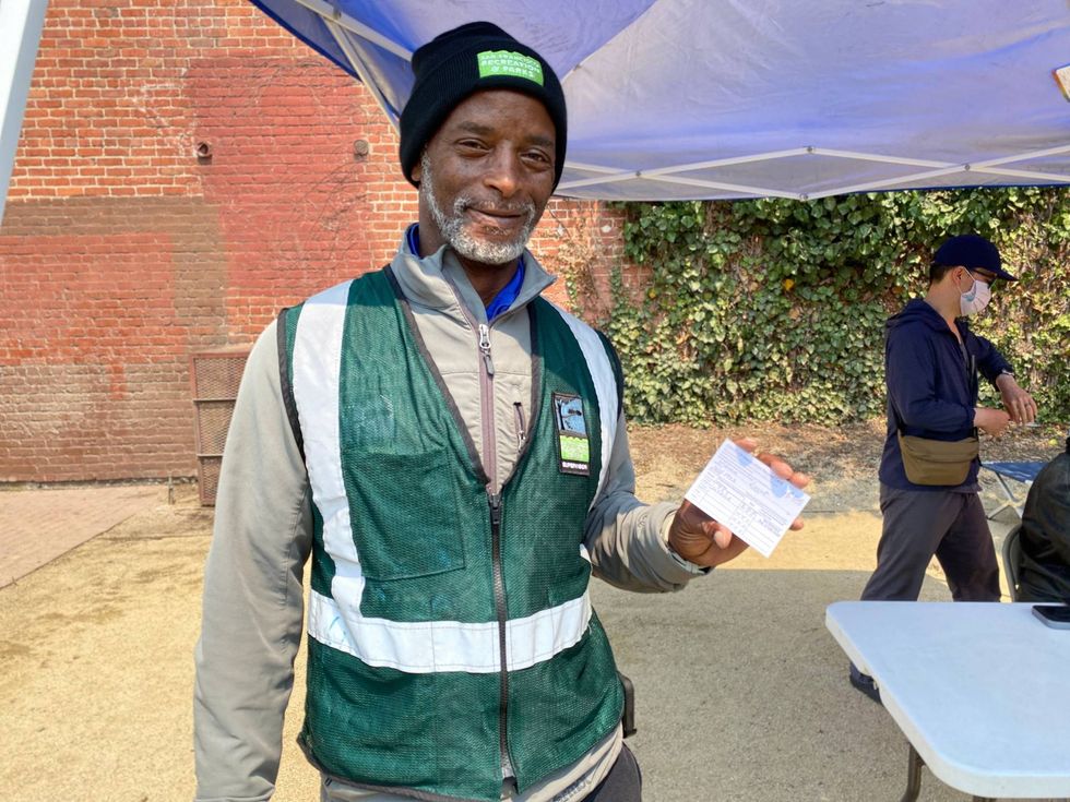 Vincent Webster got vaccinated on Thursday with help from Mayor London Breed.