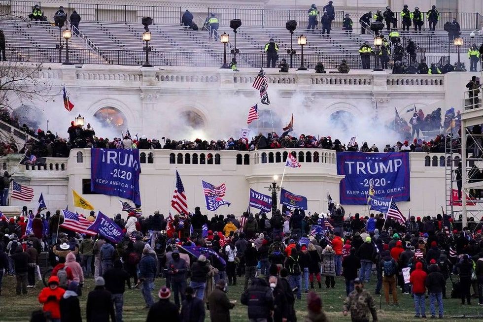 Violent insurrectionists loyal to President Donald Trump storm the Capitol, Jan. 6, 2021, in Washington.