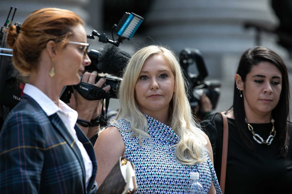 Virginia Giuffre, a victim of Jeffrey Epstein, center, exits from federal court in New York, U.S., on Tuesday, Aug. 27, 2019.