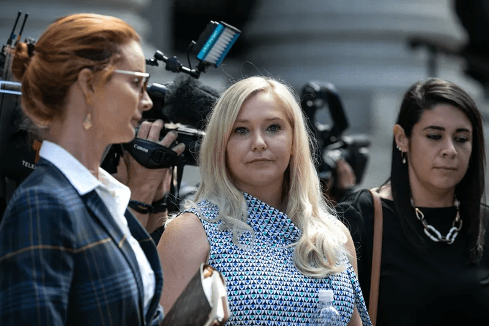 Virginia Giuffre, a victim of Jeffrey Epstein, center, exits from federal court in New York, U.S., on Tuesday, Aug. 27, 2019.