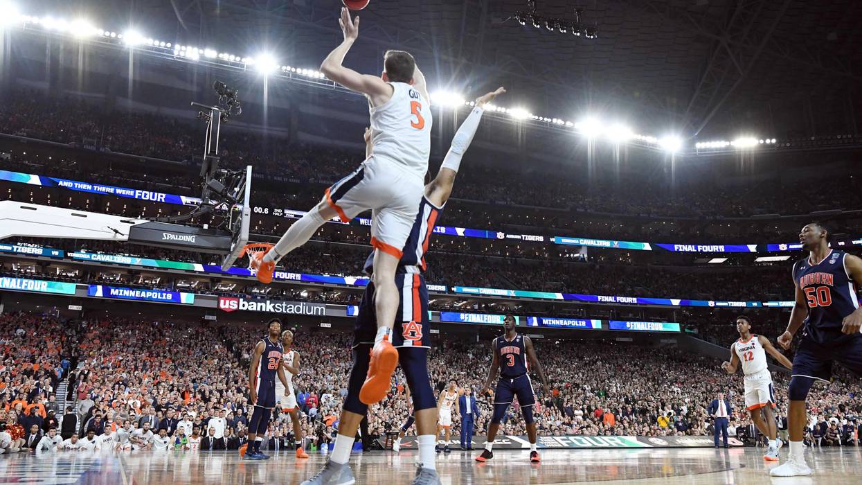 Virginia guard Kyle Guy is fouled with 0.6 seconds left in his team's win in the Final Four.