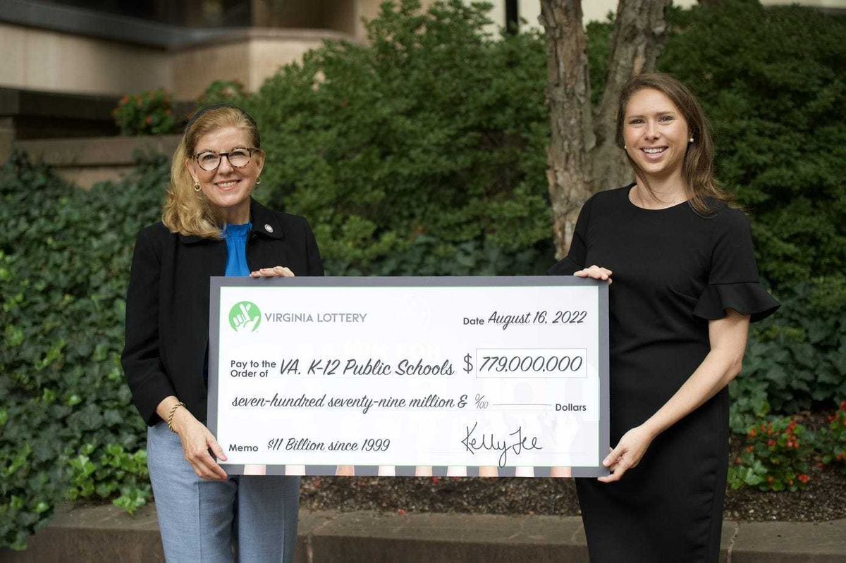 Virginia's Secretary of Education Aimee Guidera (left) and Lottery Executive Director Kelly Gee (right) show off profits