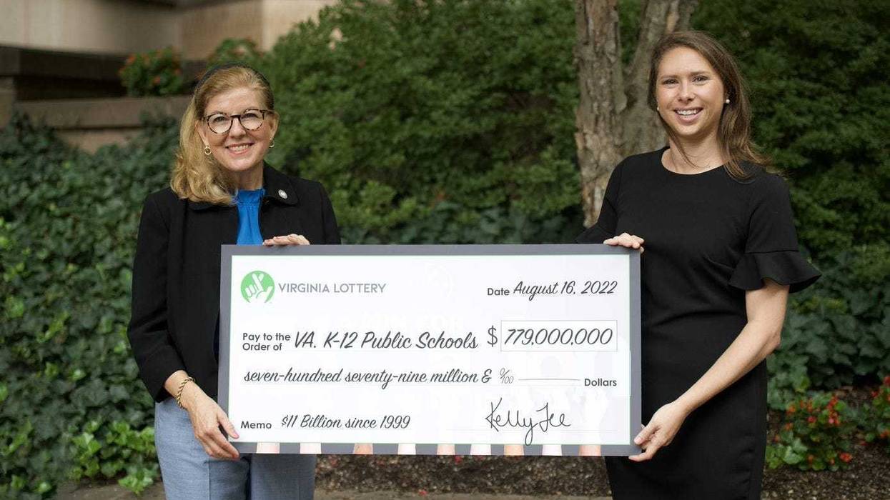 Virginia's Secretary of Education Aimee Guidera (left) and Lottery Executive Director Kelly Gee (right) show off profits