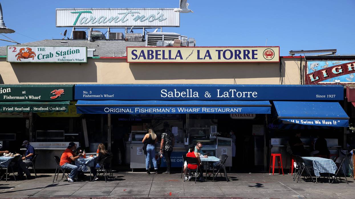 Visitors eat lunch at Fisherman's Wharf on August 13, 2020 in San Francisco, California.