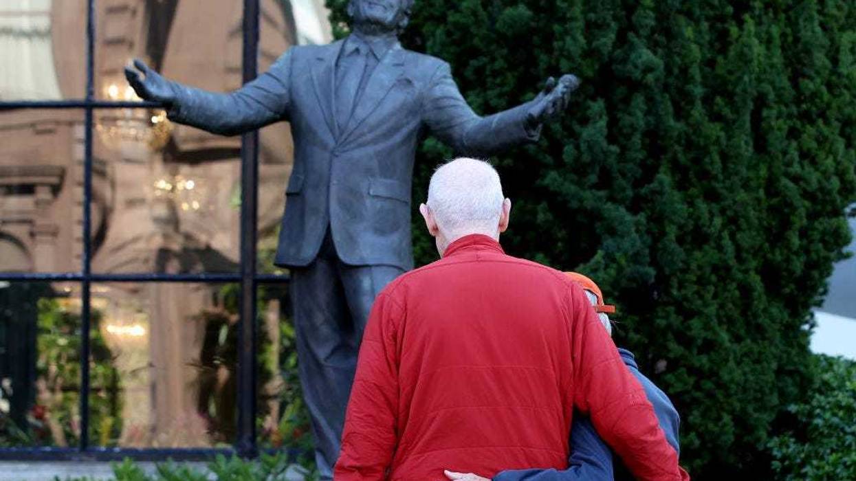 Visitors look at a statue of Tony Bennett at the Fairmont Hotel on July 21, 2023 in San Francisco, California. Legendary crooner Tony Bennett died this morning at the age of 96, two weeks short of his birthday. Bennett was diagnosed with Alzheimer’s disease in 2016. The singer was best known for his song "I left my heart in San Francisco" and was the recipient of 19 Grammy awards. (Photo by Justin Sullivan/Getty Images)