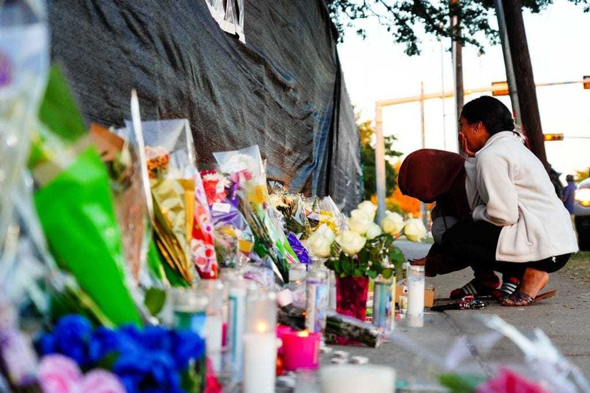Visitors look at the memorial outside of the canceled Astroworld festival at NRG Park on November 7, 2021 in Houston, Texas.