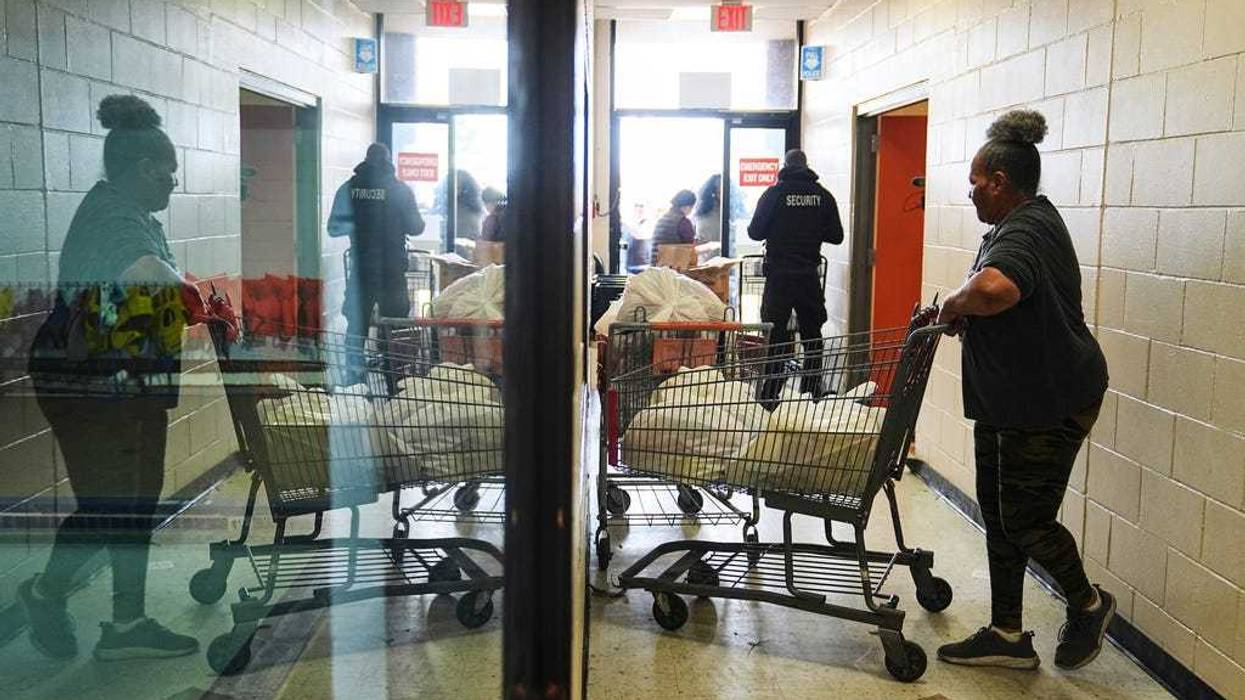 Volunteer Karen Robinson moves groceries during an emergency food distribution at The Jewish Federation of Greater Philadelphia's Mitzvah Food Program in Philadelphia, Friday, Nov. 7, 2025.