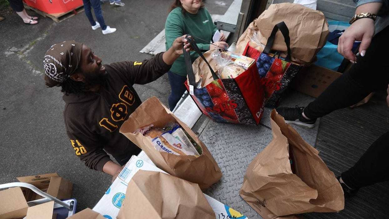Volunteers assist in food delivery on Buffalo's east side