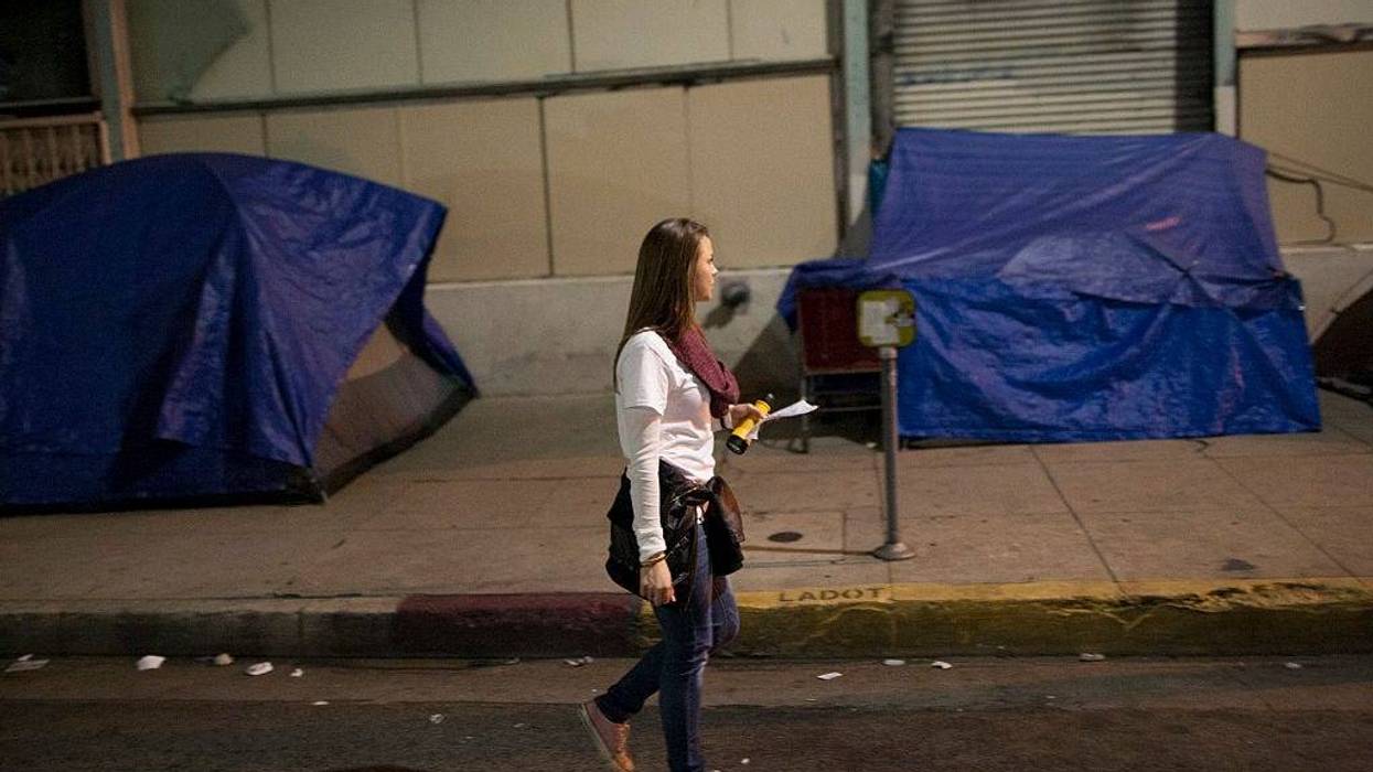 Volunteers count homeless people on Skid Row during the 2015 Greater Los Angeles Homeless Count conducted by the Los Angeles Homeless Services Authority (LAHSA) on January 29, 2015 in Los Angeles, California. About 6,000 volunteers take part in counting the homeless people that they see as well as tents, cars and other structures used by the homeless, but avoid estimating the amount of people that might be inside such shelters. The last Greater Los Angeles Homeless Count, which took place in 2013, found that LA had one of the largest homeless populations in the country, with more than 39,000 men, women and children living on the streets. (Photo by David McNew/Getty Images)