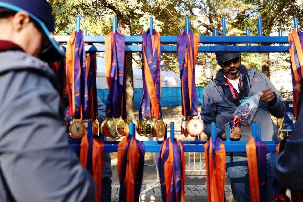 Volunteers hang medals ahead of the 2024 TCS New York City Marathon on Nov. 3, 2024 in New York City.