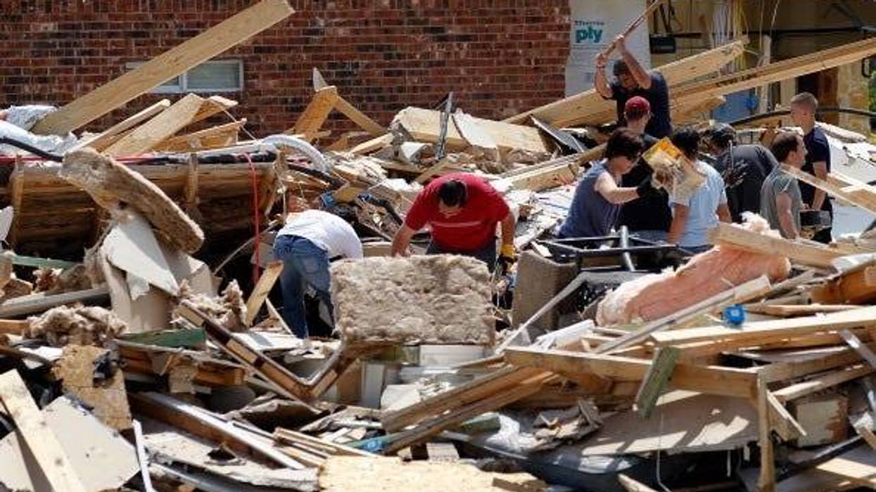 Volunteers help homeowners search through the rubble of their destroyed homes following a tornado on April 4, 2012 in Forney, Texas. Multiple tornadoes touched down yesterday across the Dallas/Fort Worth area causing extensive damage.
